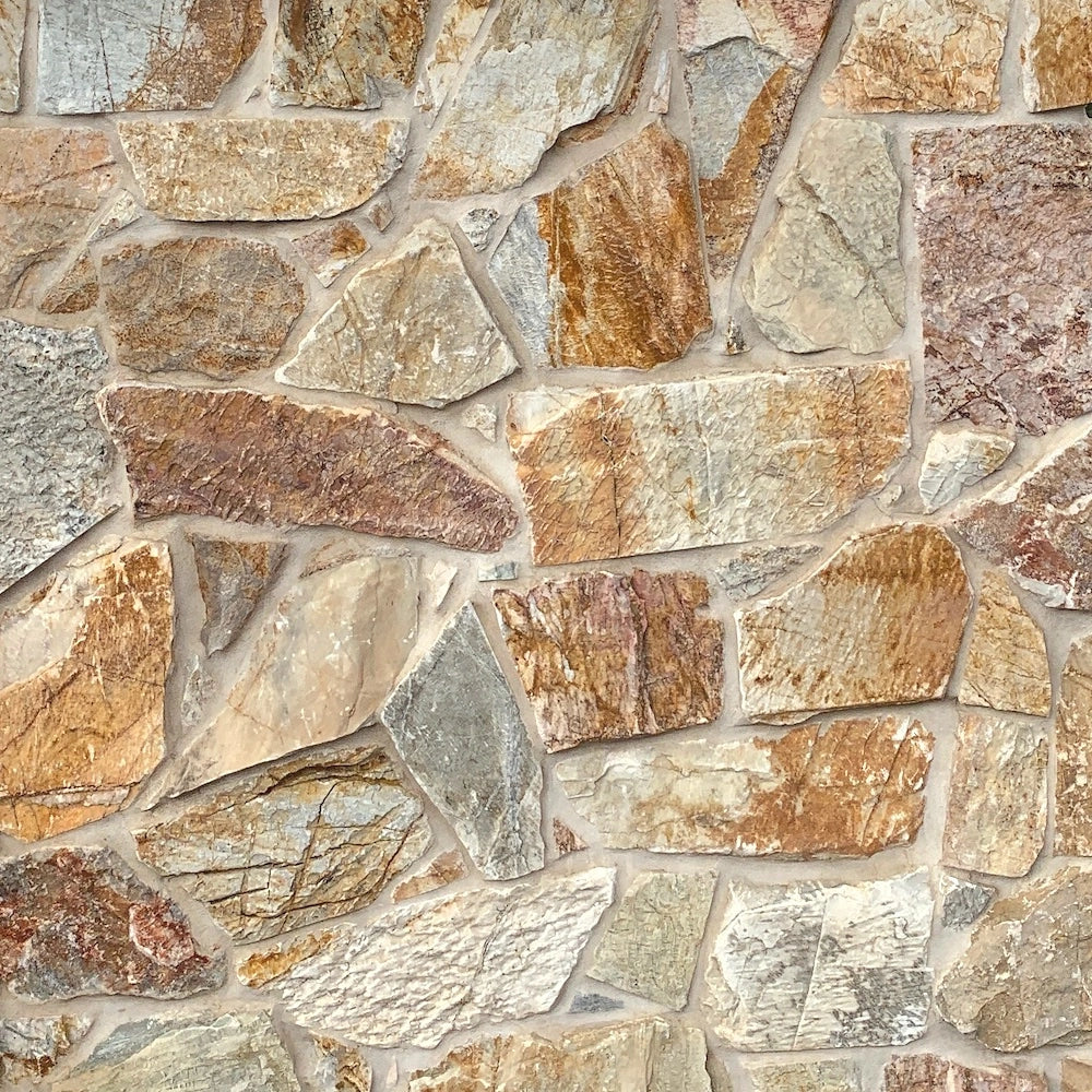 Laverton organic walling with warm gold and grey split stone — matching corner finish reference by Tilemall