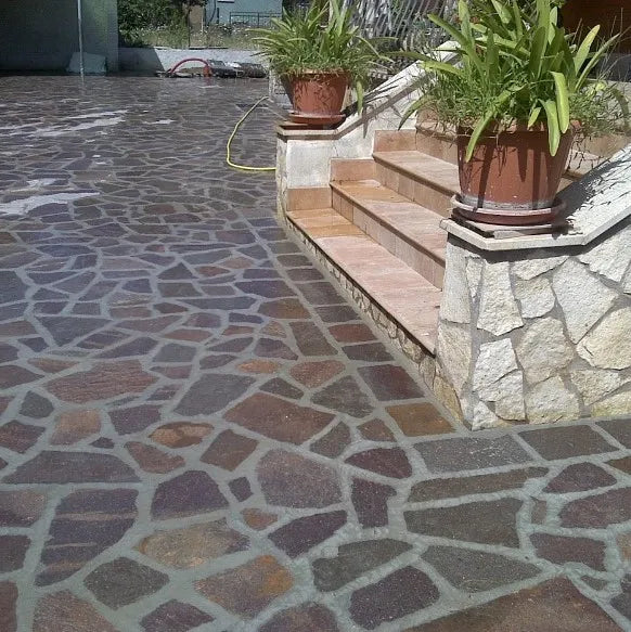 Porphyry crazy paving beside steps and a garden bed by Tilemall