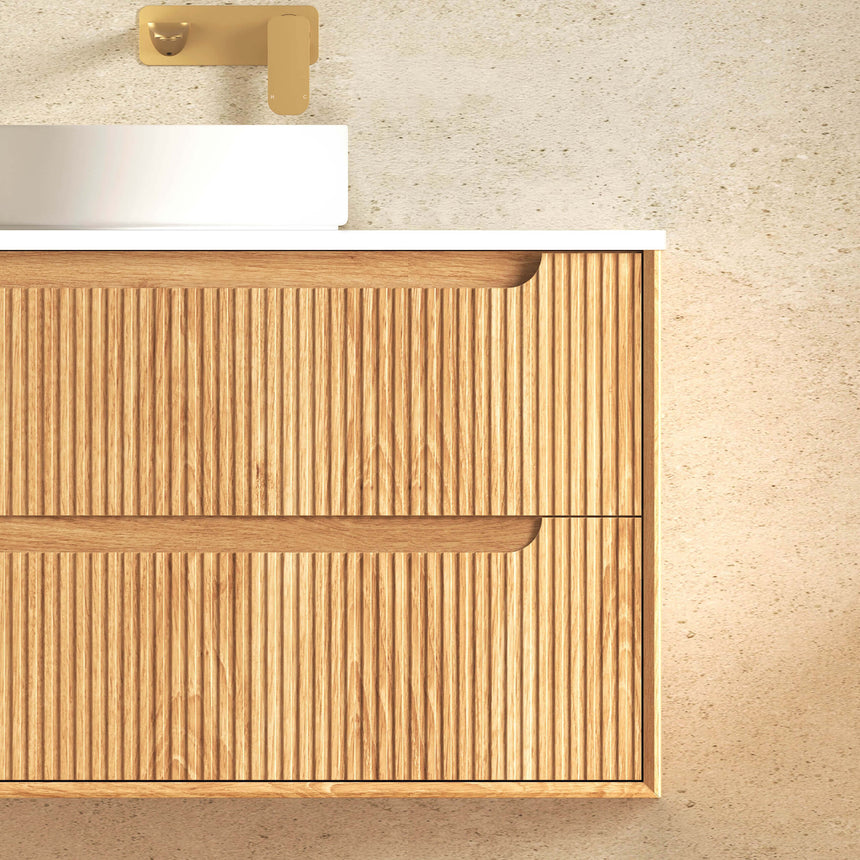 Otti Byron Fluted vanity showing two white round vessel basins with brass spout taps mounted on white top by Tilemall