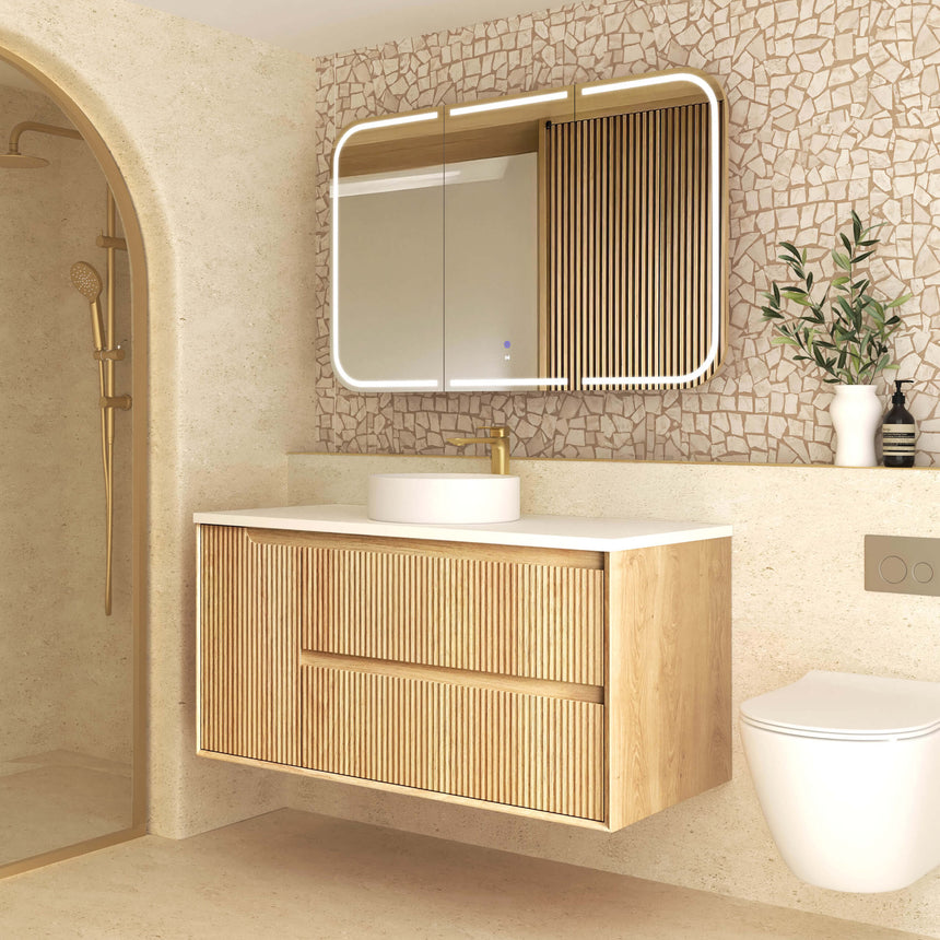 Detail of Byron Fluted woodland oak drawer fronts showing vertical flute pattern and handles by Tilemall