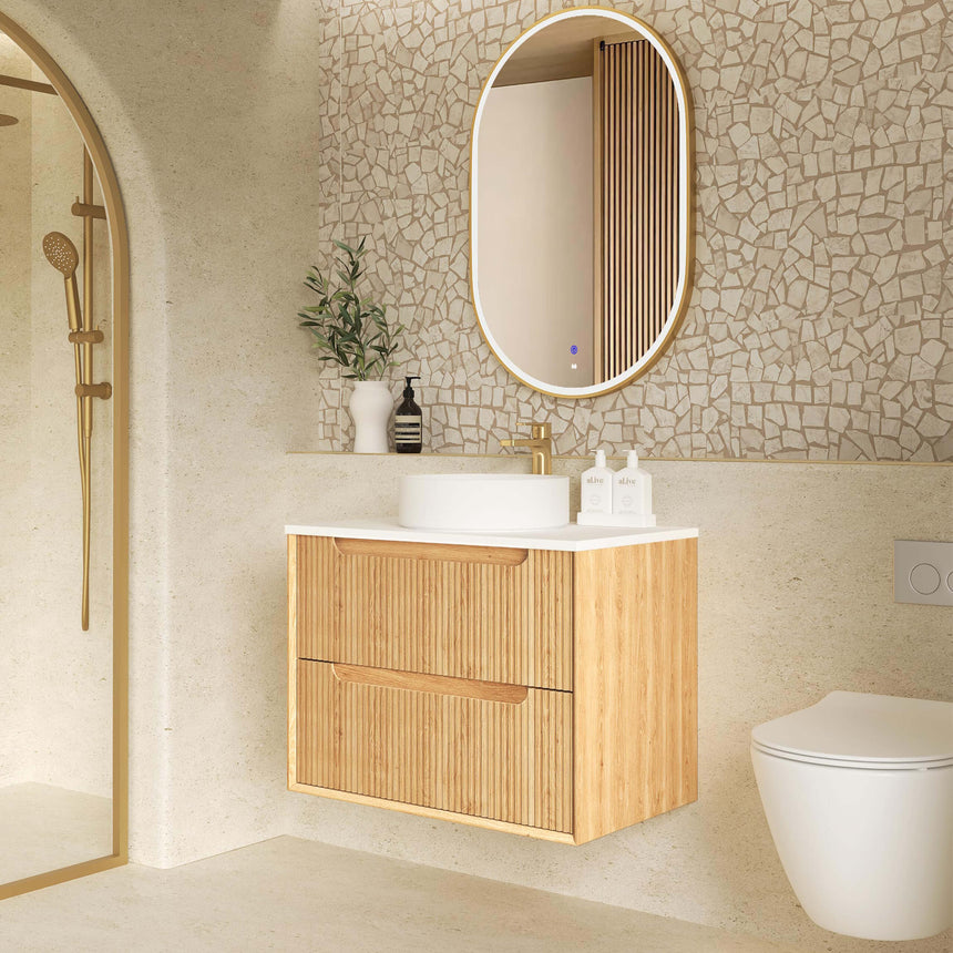 Otti Byron Fluted woodland oak wall-hung vanity with single vessel basin and gold tapware in ensuite by Tilemall