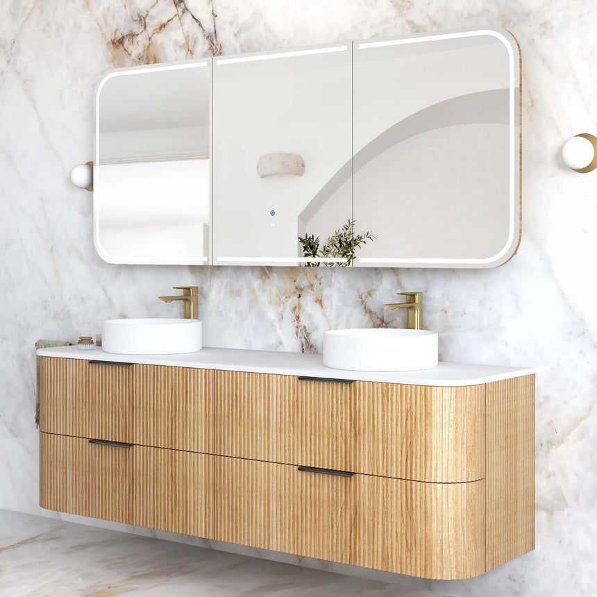 Otti Havana Fluted wall-hung vanity side angle showing fluted woodland oak profile and curved white stone top by Tilemall