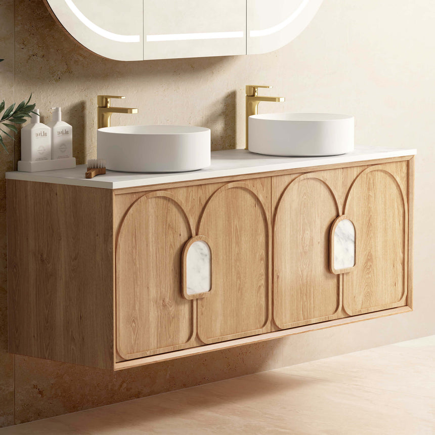 Otti Laguna MK II natural woodland oak vanity installed in bathroom interior with two white vessel basins and brass fixtures by Tilemall