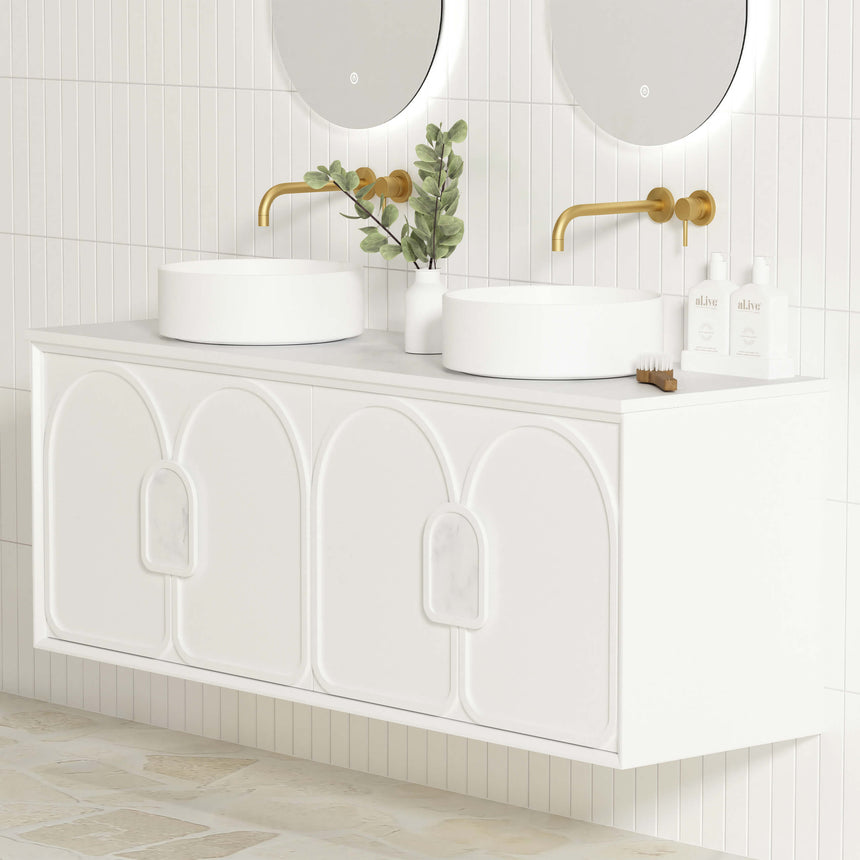 Close-up of Otti Laguna MK II vanity top showing two white vessel basins and curved door fronts with brass wall-mount taps by Tilemall