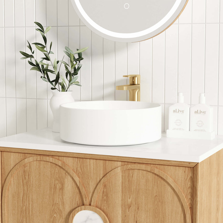 Close-up of Otti Laguna MK II vanity showing white ceramic vessel basin and brass tap by Tilemall