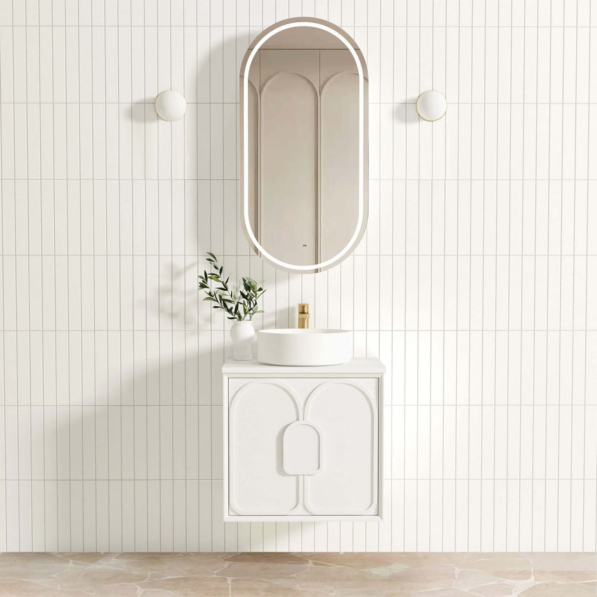 Otti Laguna MK II 600mm matte white wall-hung vanity by Tilemall with vessel basin and arched mirror in bathroom interior