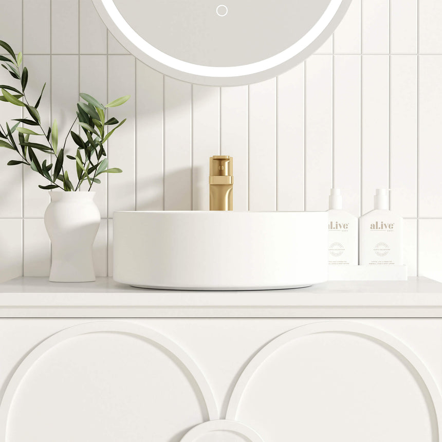 Otti Laguna MK II matte white vessel basin detail on countertop with brass tap and plant by Tilemall