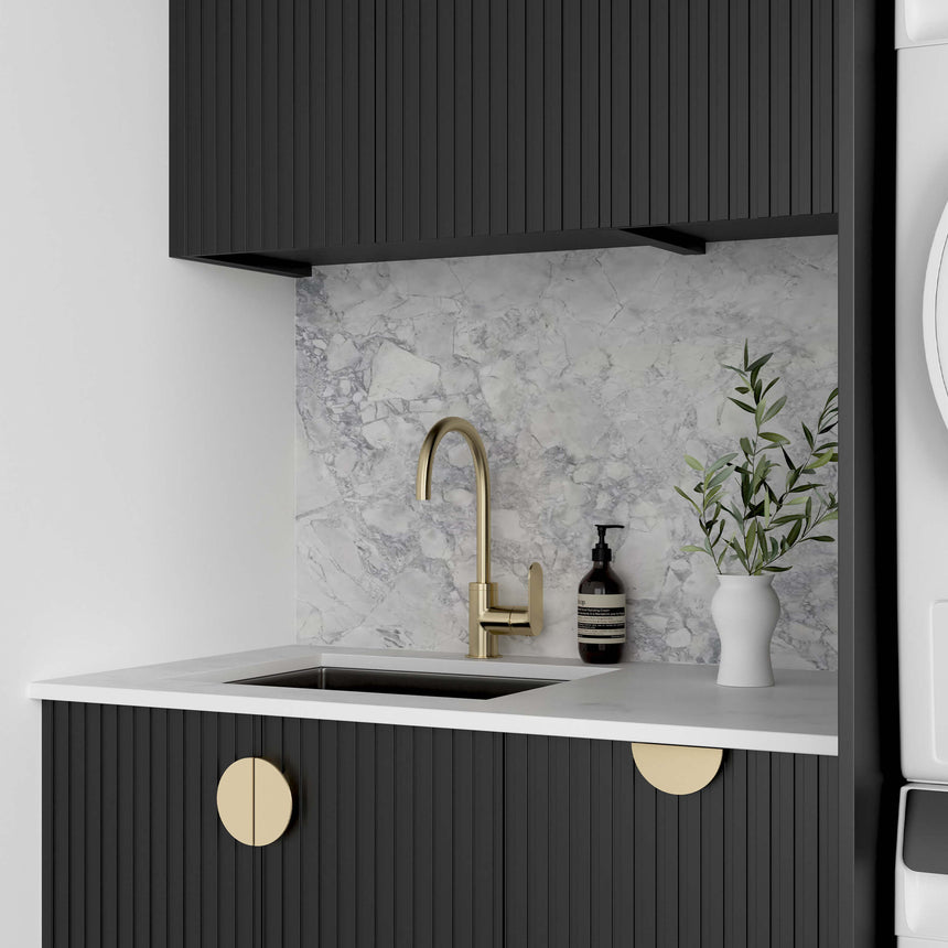 Interior view of Marlo laundry sink cabinet with adjustable shelf and open door by Tilemall