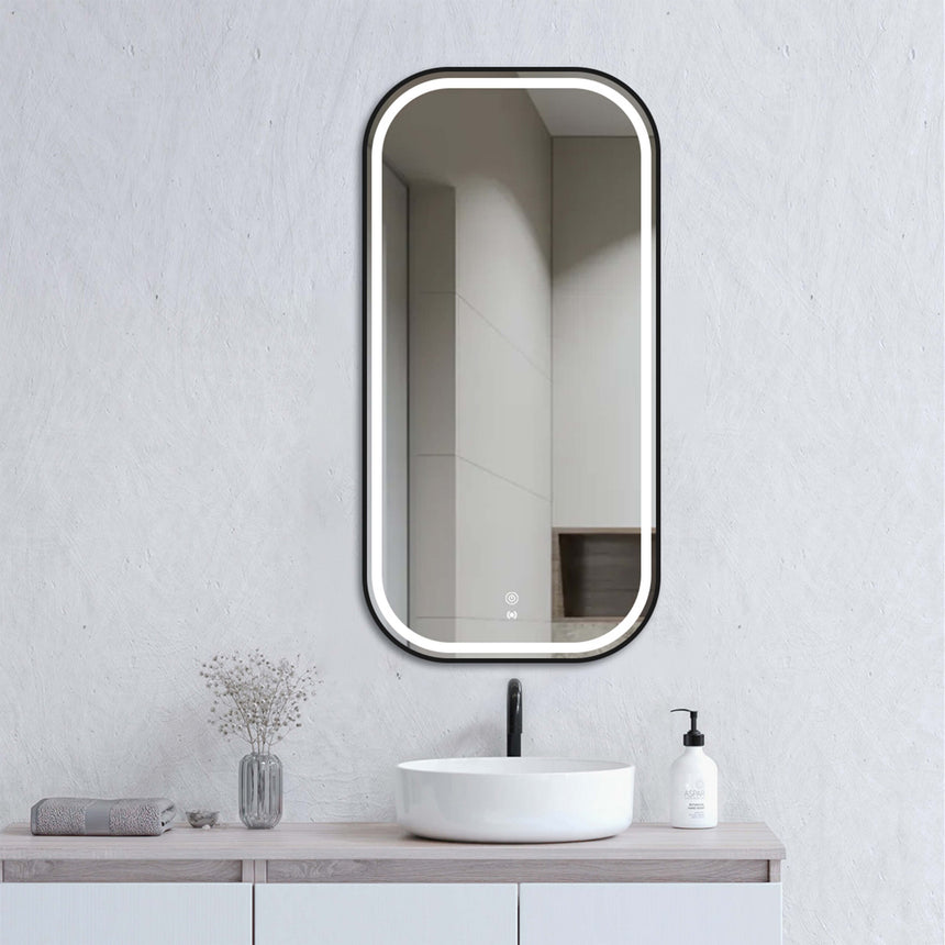 Otti Newport 900x450mm LED framed mirror by Tilemall with matte black metal frame, installed above bathroom vanity