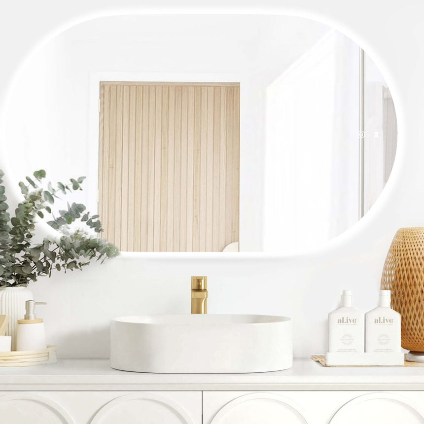 Otti Noosa 1200x750mm LED frameless bathroom mirror by Tilemall installed above white vessel basin