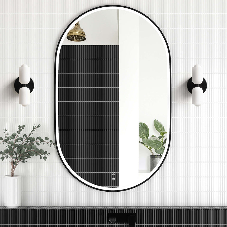Otti Noosa 900x600mm matte black framed LED mirror installed in modern bathroom interior above black vanity by Tilemall
