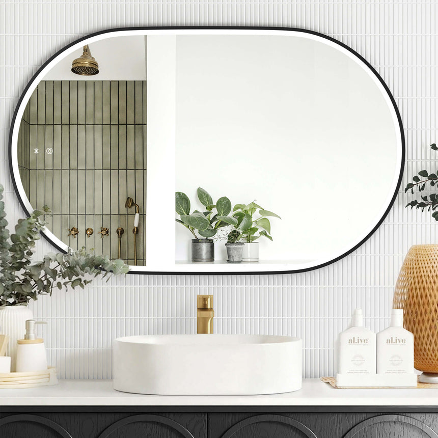 Otti Noosa 900x600mm LED mirror with matte black frame mounted horizontally above white basin by Tilemall