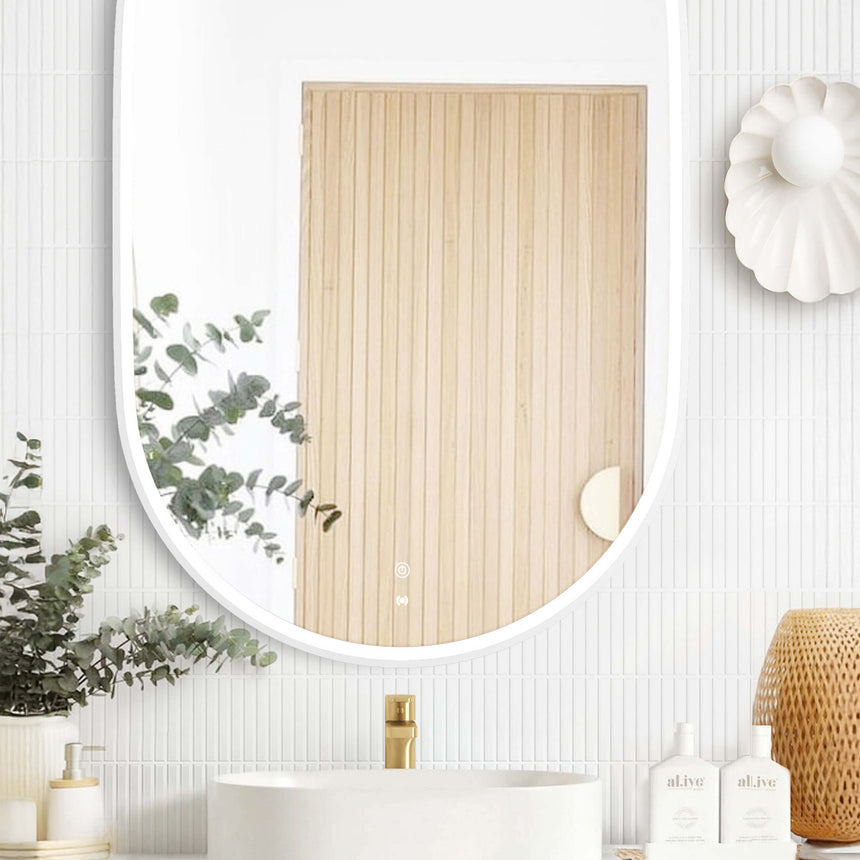 Otti Noosa white framed LED mirror 900x600mm mounted above white vessel basin in modern ensuite by Tilemall