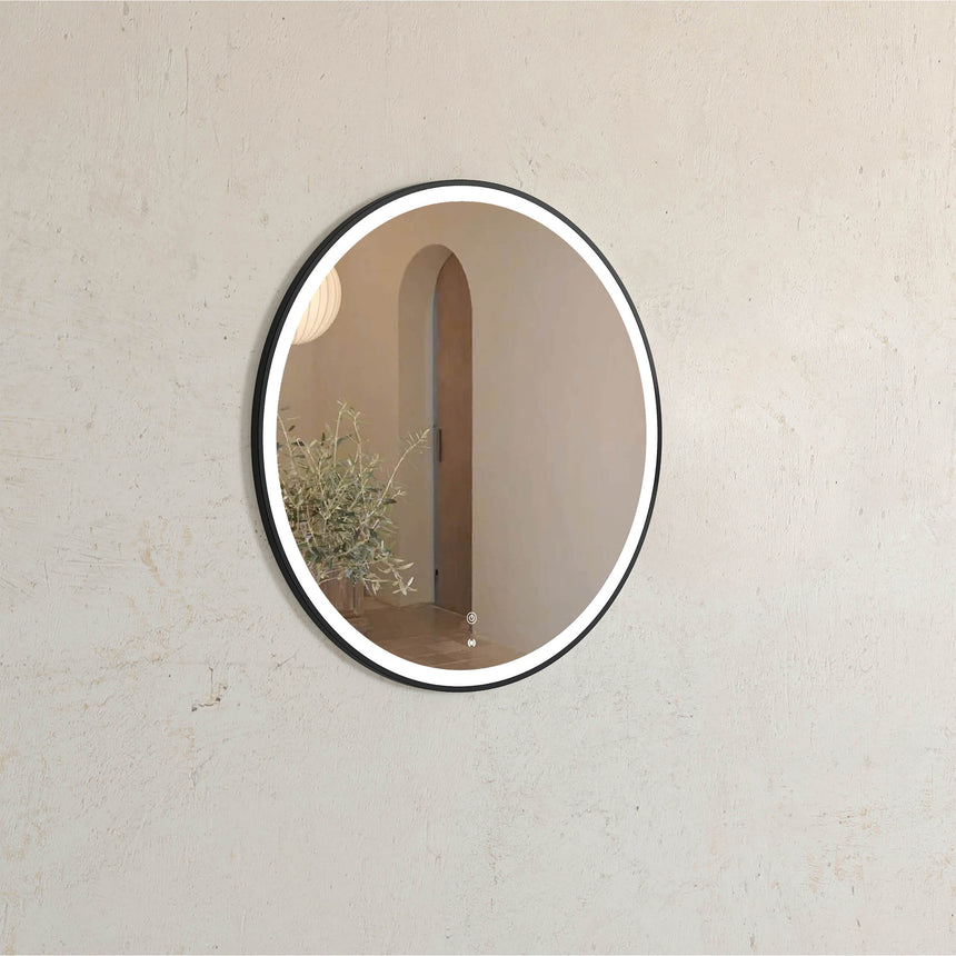 Otti Bondi 800x800mm oval LED mirror by Tilemall with matte black metal frame installed in bathroom interior