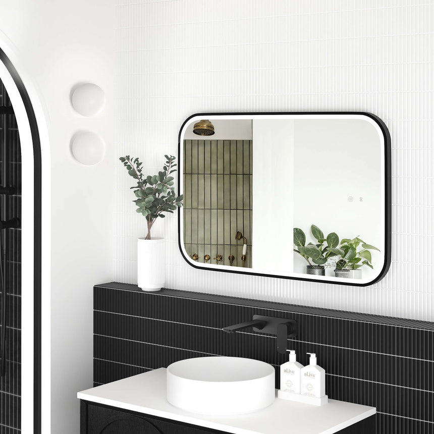 Otti Newport matte black metal frame LED mirror 900x600mm by Tilemall in modern ensuite with white vessel basin