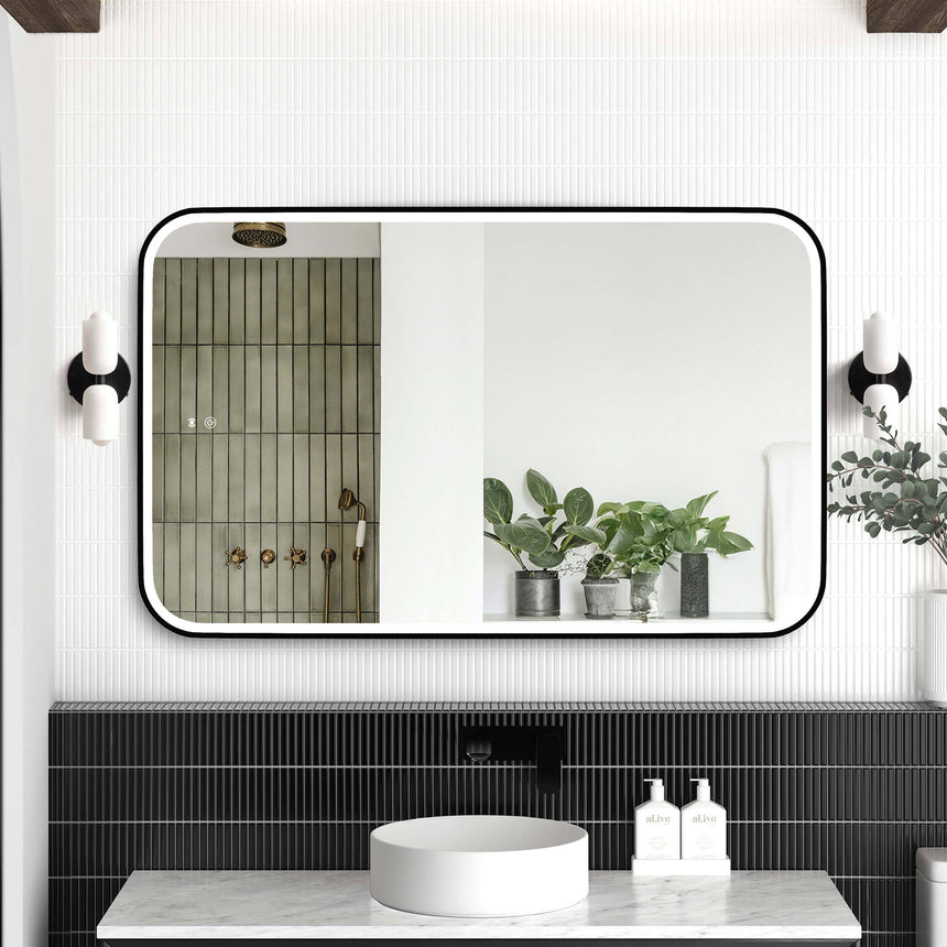 Otti Newport 1200x750mm LED framed mirror by Tilemall, matte black metal frame, installed above bathroom vanity