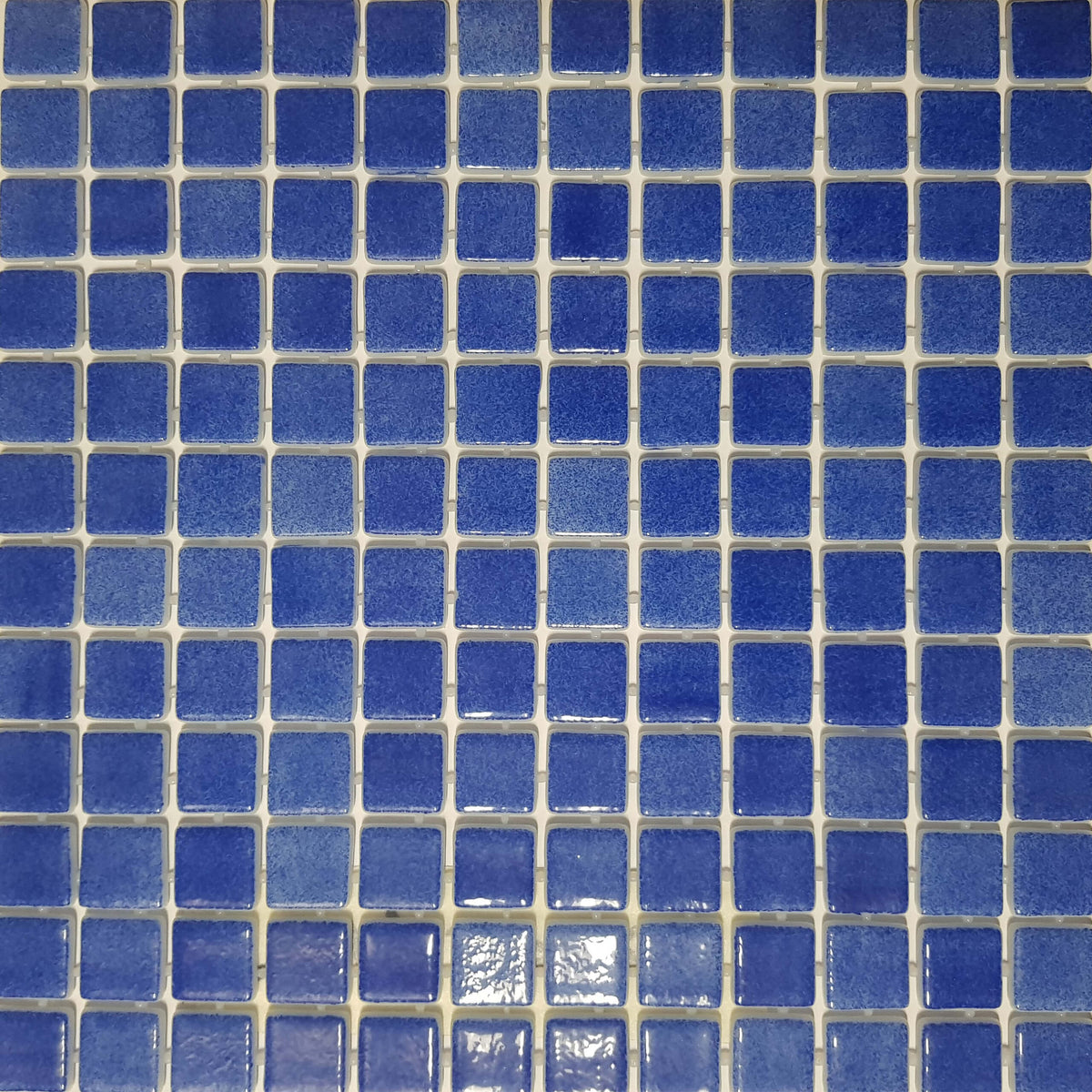 Vidrepur 25x25mm Jerez glass mosaic tiles in grid layout showing deep blue colour variation and glossy finish by Tilemall