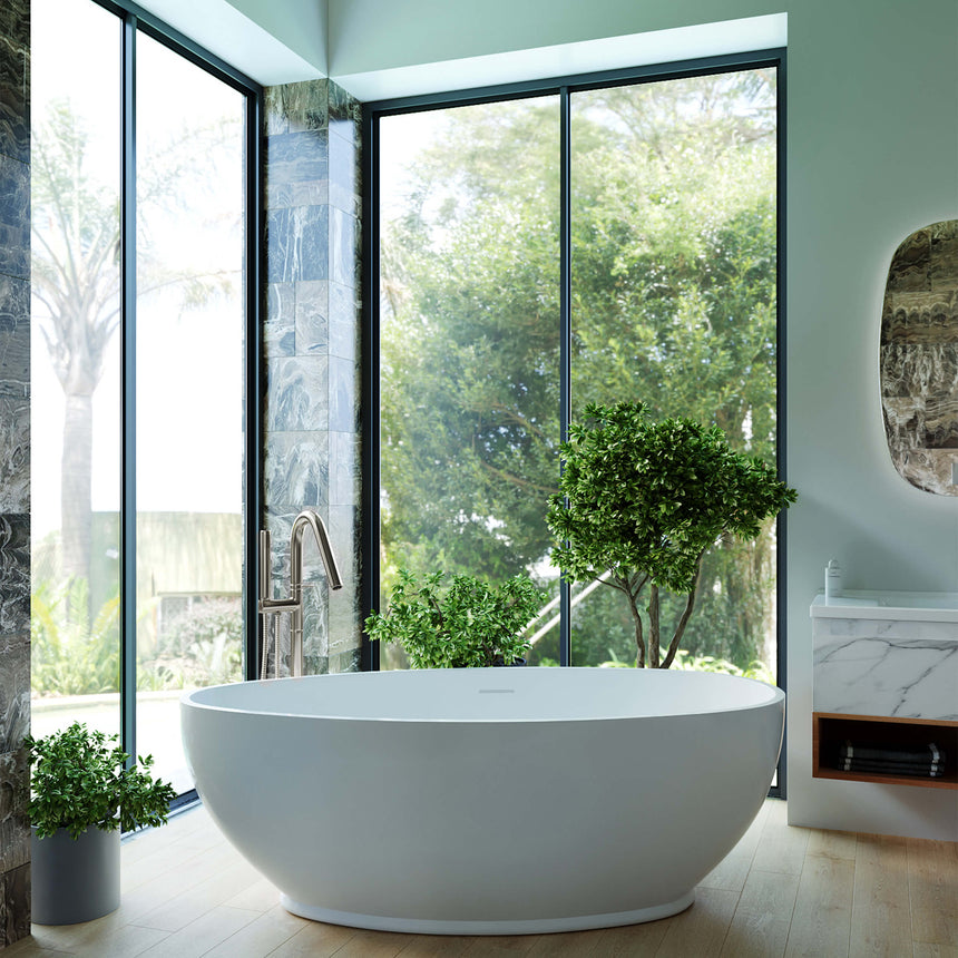 BelBagno Bath freestanding acrylic bathtub by Tilemall in modern ensuite with windows and greenery