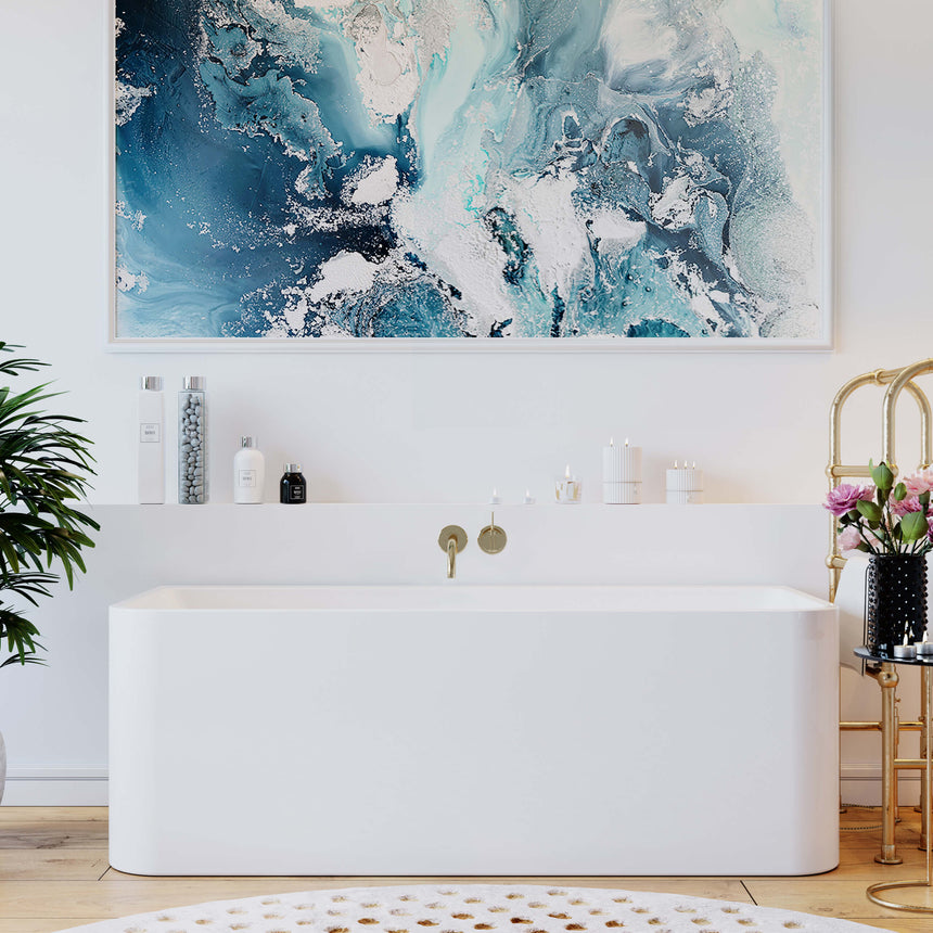 BelBagno Bath Alto bathtub installed in ensuite with wall-mounted brass tap and artwork by Tilemall