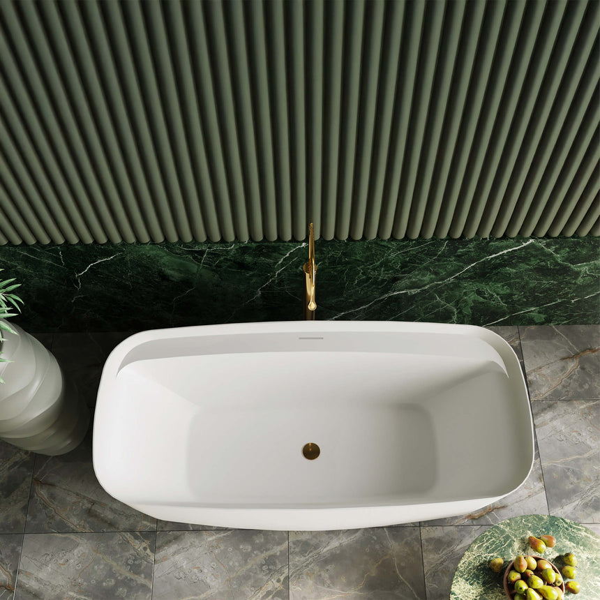 BelBagno Bath Terriccio freestanding acrylic bathtub installed in bathroom interior with marble wall and brass tap by Tilemall