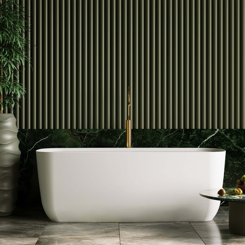 BelBagno Terriccio freestanding bath installed against green fluted wall with marble surround and brass filler tap by Tilemall