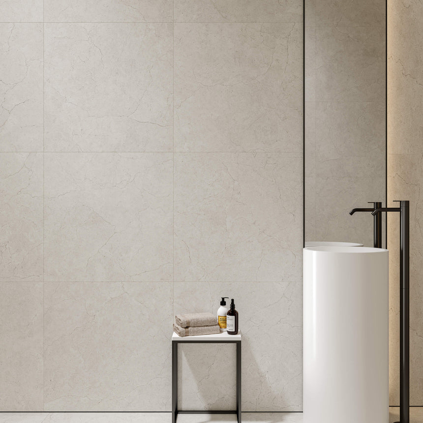 Crema Marfil 600x600mm matt bianco porcelain tiles installed as bathroom feature wall with pedestal basin by Tilemall