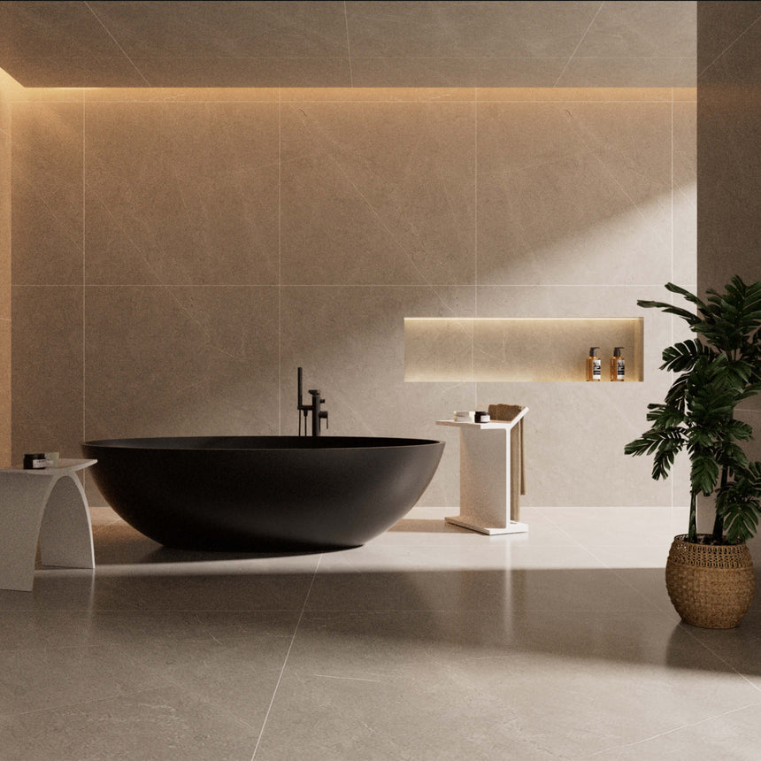 Kirra freestanding oval stone bath by Tilemall in matt black, 1760mm, installed in modern bathroom interior