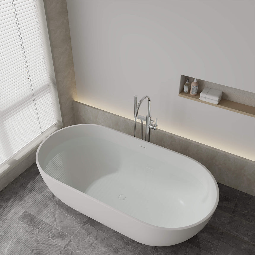 Lukka Solid Surface Bath 1500x750mm kirra bathtub installed in modern bathroom with concrete surround and chrome tap by Tilemall