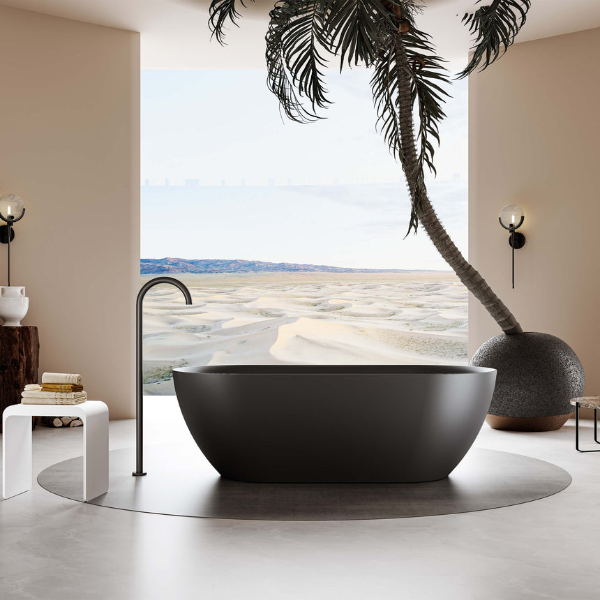 Ellips Slim freestanding acrylic bathtub by Tilemall in matt black, 1700mm, installed in bathroom interior