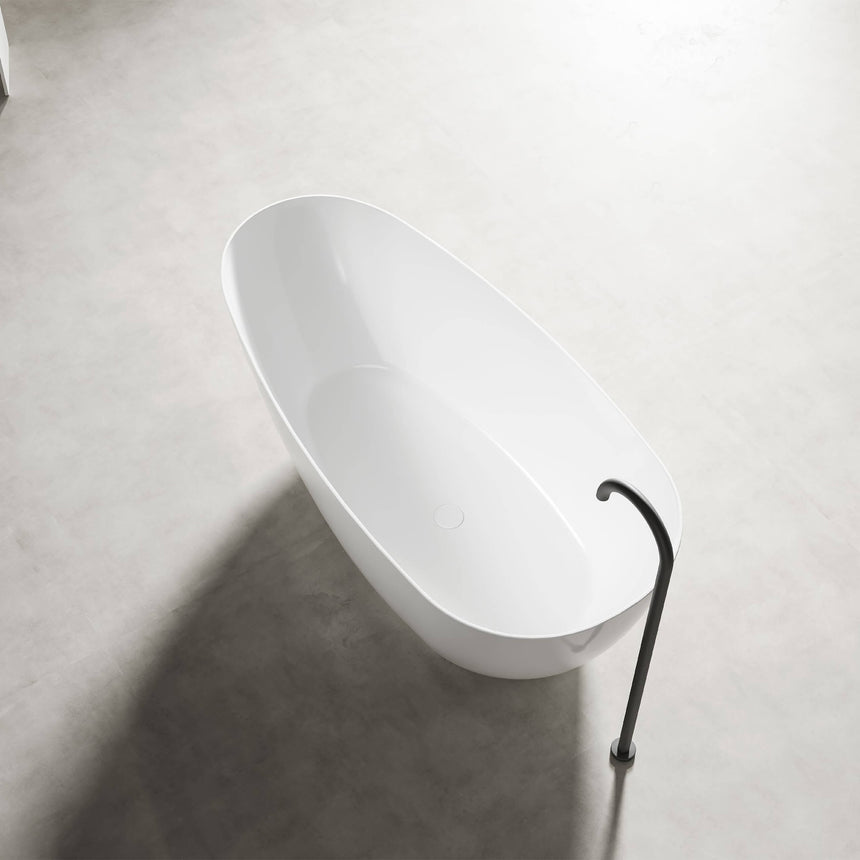 Freestanding oval acrylic bathtub by Tilemall in gloss white, 1690mm, with black floor-standing tap and overflow