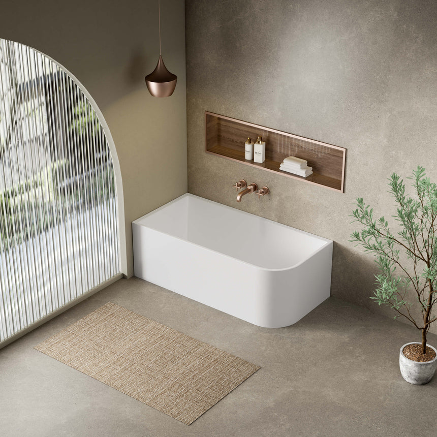 Clayton freestanding corner bath by Tilemall installed in modern bathroom, gloss white, 1700mm, left corner configuration