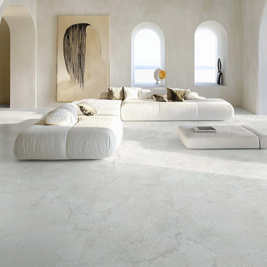 Portland 1200x600x9.5mm ivory stone-look tiles installed as large-format living area floor with modern furniture by Tilemall