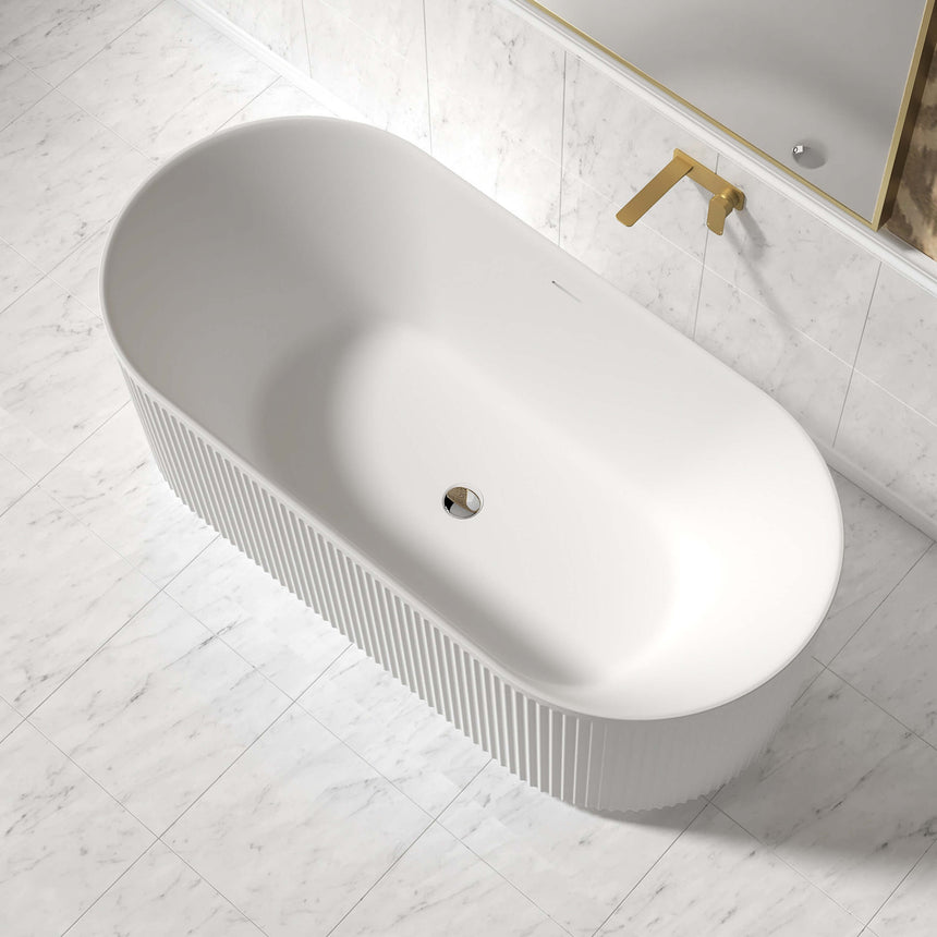 Otti Attica Havana 1500mm bathtub installed in bathroom interior with marble tile and brass tapware by Tilemall