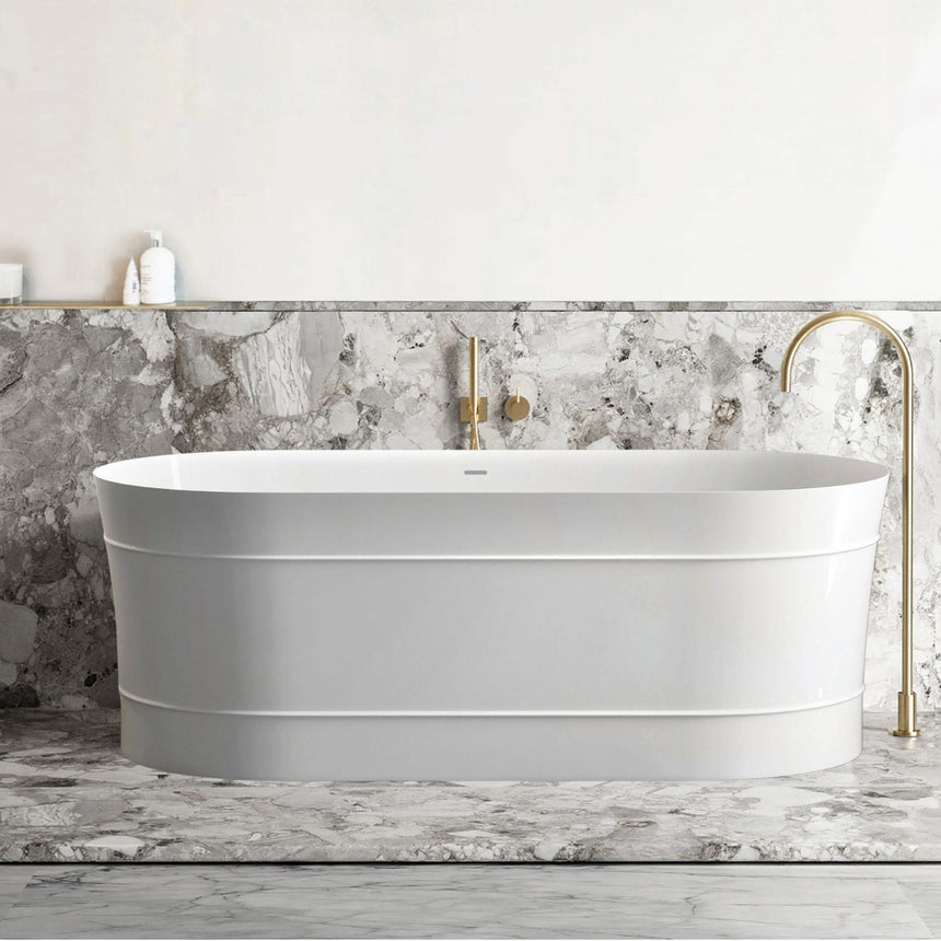 Otti Attica Bondi bathtub installed in bathroom interior with marble tile surround and brass tapware by Tilemall