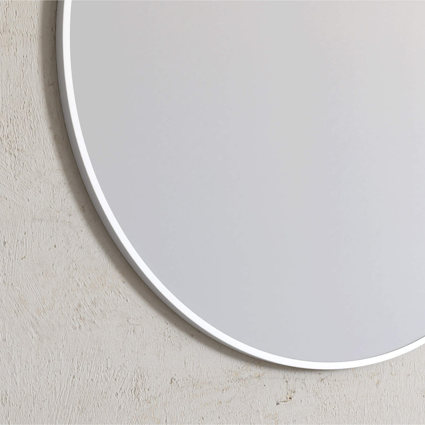 Close-up of white frame edge detail on Otti 700mm round mirror showing frame profile by Tilemall