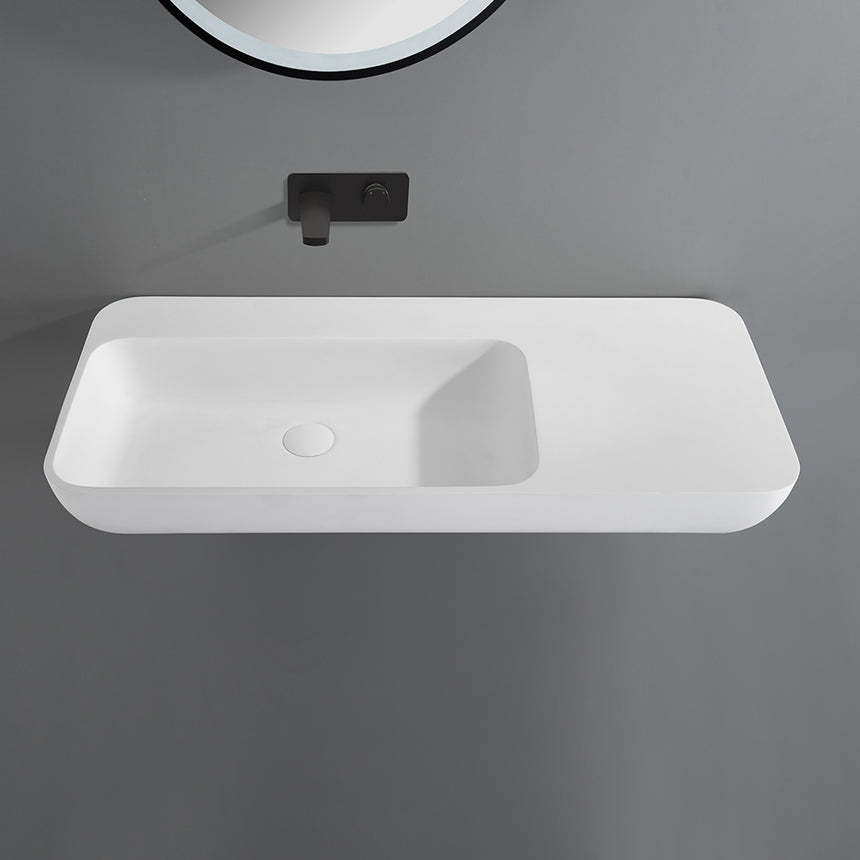 Lukka Rocca 900x400mm matte white solid surface wall-hung basin by Tilemall with black wall-mounted tap