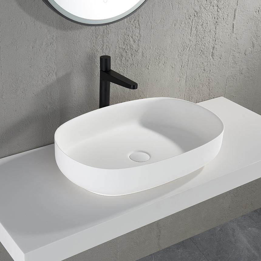 Lukka ellips basin 600x400mm installed on white vanity with black tap in bathroom interior by Tilemall
