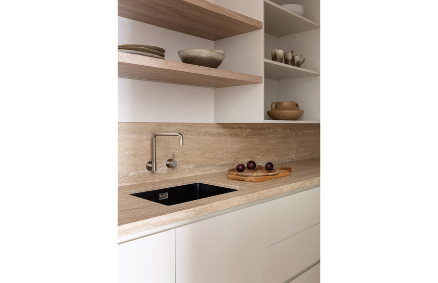 Phoenix 5000 matte black sink in travertine benchtop with dual tap configuration by Tilemall