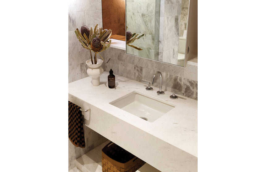 Close-up of Phoenix Vivid Slimline Plus chrome basin mixer with lever handles at vessel basin by Tilemall