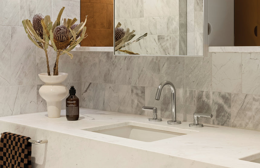 Phoenix Vivid Slimline Plus chrome basin mixer three-hole installation on marble countertop by Tilemall