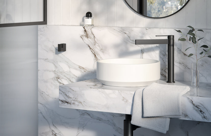 Phoenix Lexi MKII matte black vessel mixer on marble countertop with white porcelain basin and towel by Tilemall
