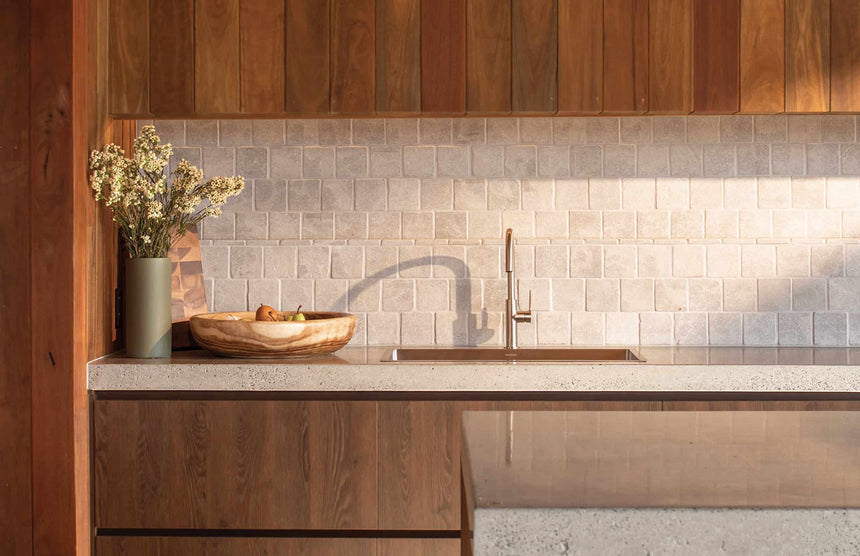 Phoenix 4000 sink in kitchen island with concrete benchtop and wooden cabinetry by Tilemall