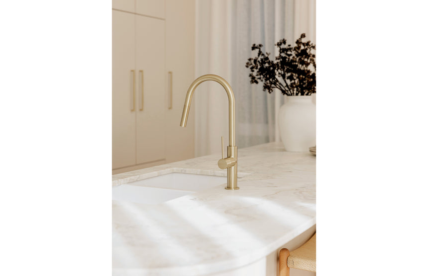 Close-up of Phoenix Vivid Slimline brushed gold pull out sink mixer showing pulled spray head by Tilemall