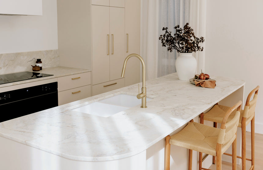 Phoenix Vivid Slimline brushed gold pull out sink mixer in open-plan kitchen with island bench by Tilemall