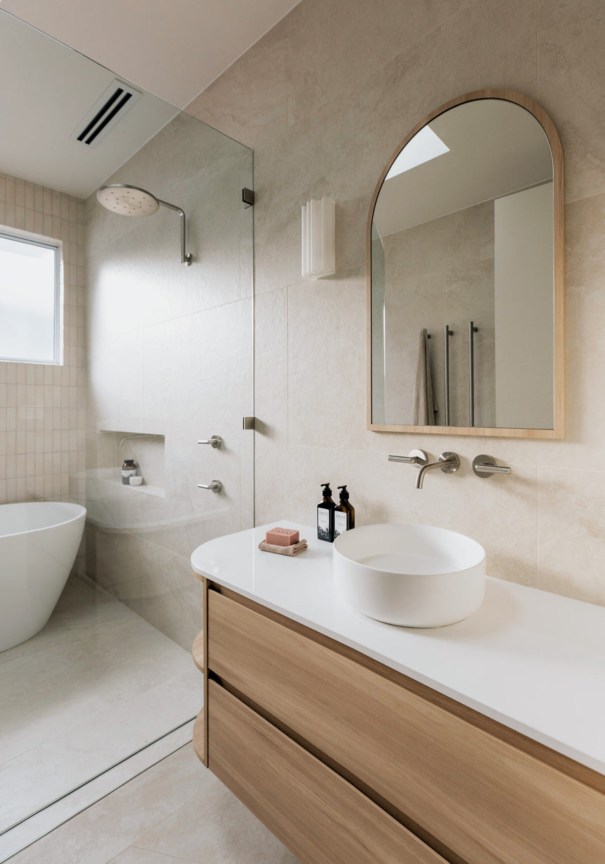 Phoenix Vivid Slimline Plus Wall Basin / Bath Outlet 180mm Brushed Nickel, shown in a finished interior