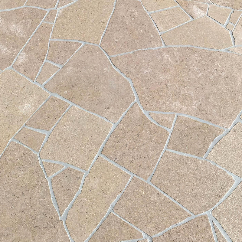 Avani Limestone close view of warm beige irregular paving and pale joints by Tilemall