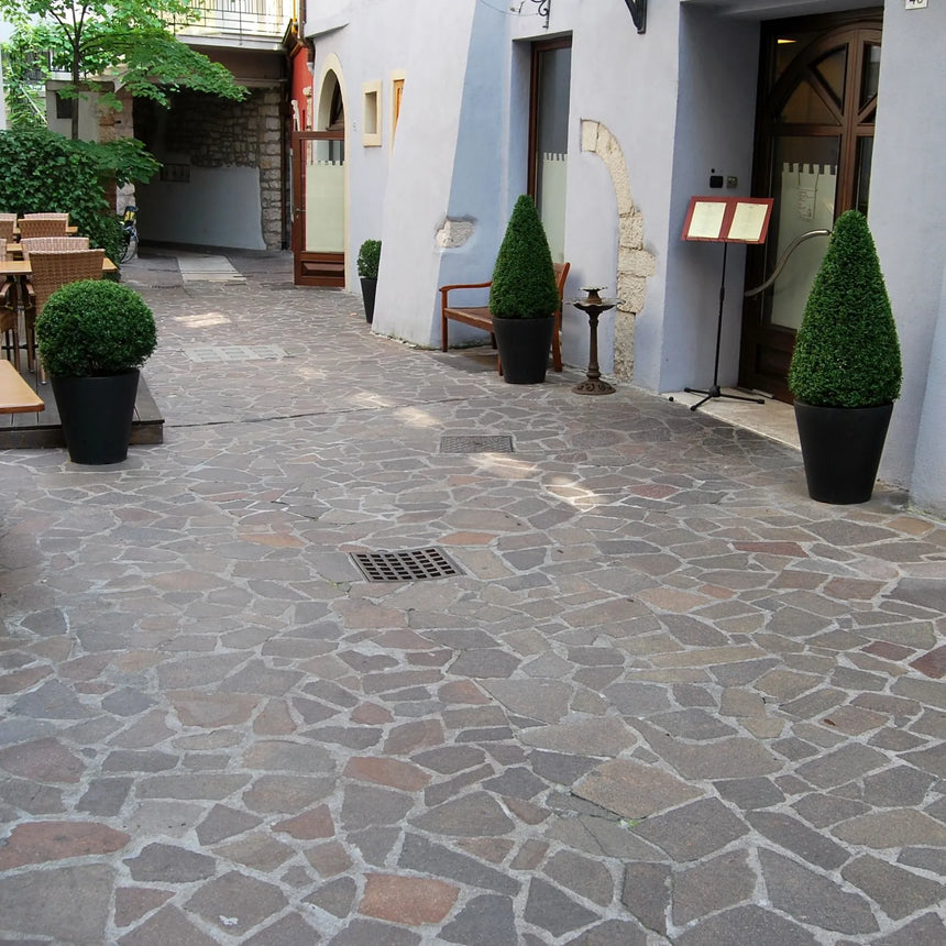 Porphyry crazy paving in an outdoor courtyard by Tilemall