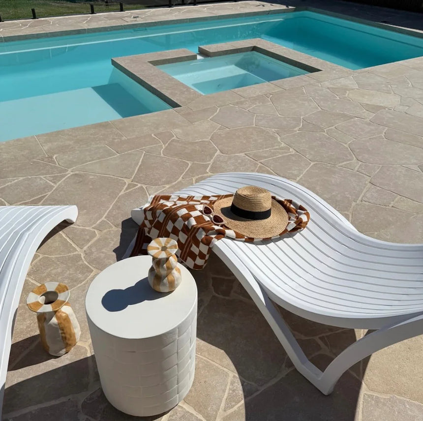 Avani Limestone poolside crazy paving beside white outdoor chairs by Tilemall