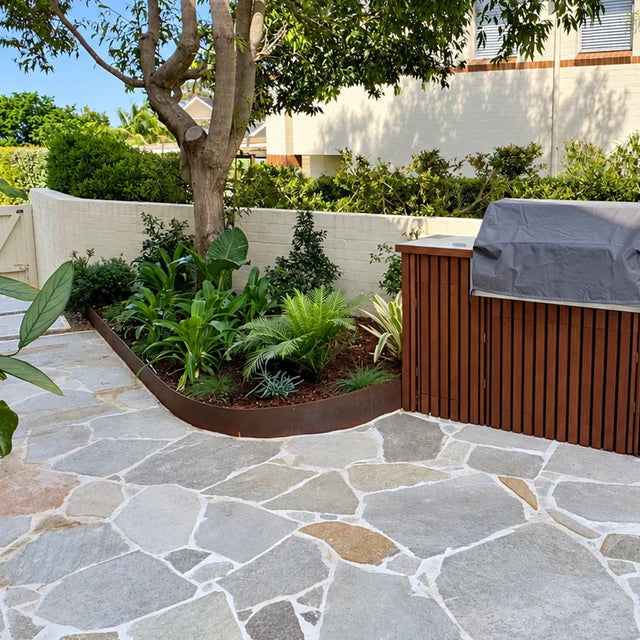 Mangolia Limestone crazy paving with grey and beige stone in a garden courtyard by Tilemall