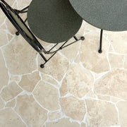 Classic Light Travertine crazy paving installation — supplier product-page reference; natural stone varies